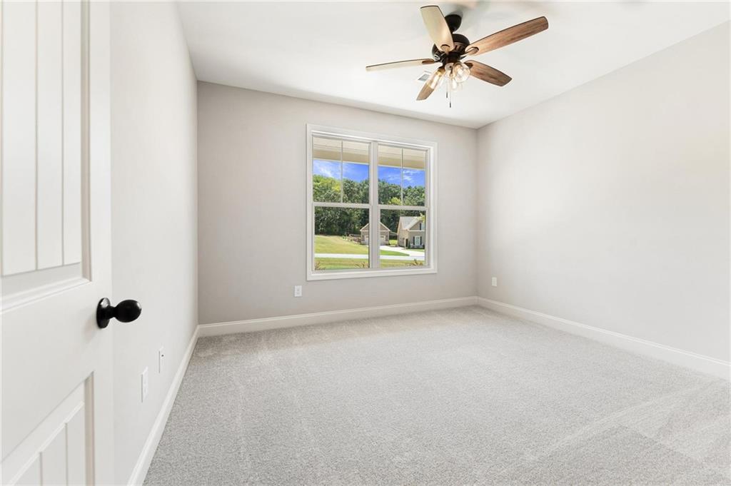 280 Camden Loop Jefferson, GA 30549 - Photo 28 of 43 a view of a room with a window and a ceiling fan