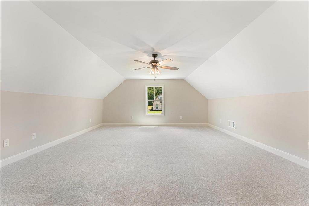 280 Camden Loop Jefferson, GA 30549 - Photo 31 of 43 an empty room with a window and a ceiling fan