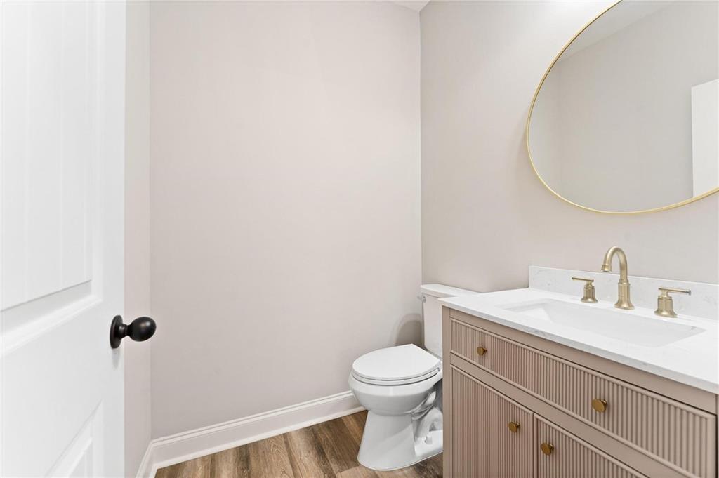 280 Camden Loop Jefferson, GA 30549 - Photo 35 of 43 a bathroom with a toilet a sink and mirror