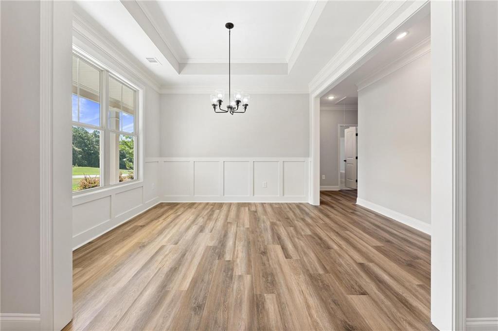 280 Camden Loop Jefferson, GA 30549 - Photo 8 of 43 a view of an empty room with wooden floor and a window