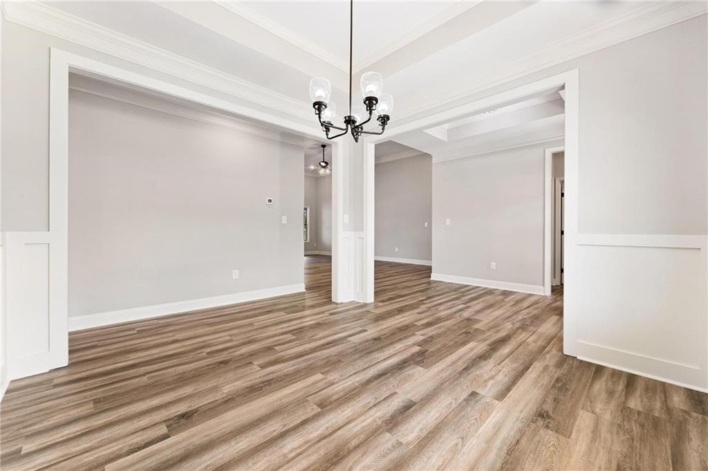 280 Camden Loop Jefferson, GA 30549 - Photo 9 of 43 a view of an empty room with window and wooden floor