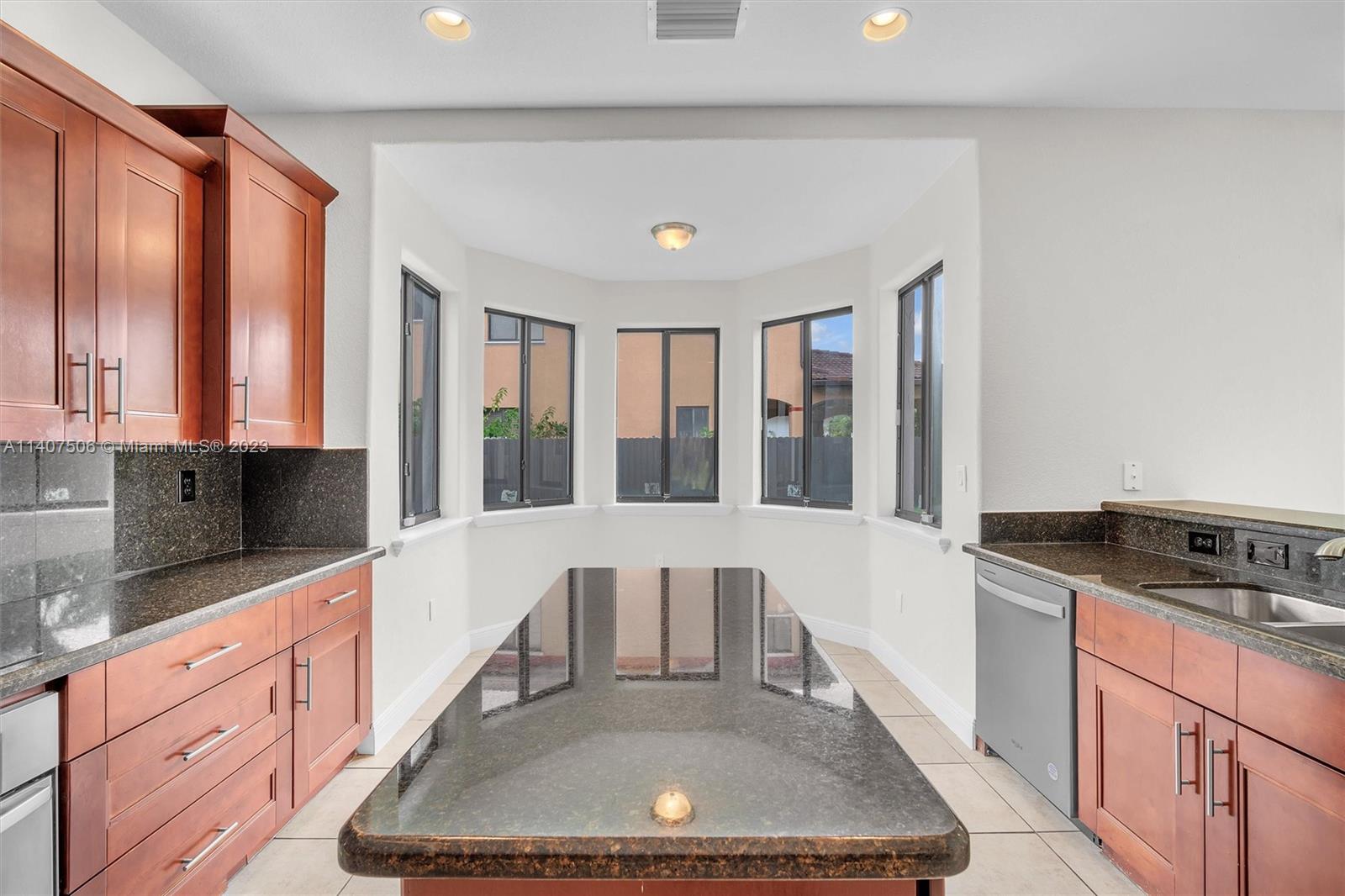 Tamiami Miami, FL 33184 - Photo 16 of 46 a kitchen with a sink and cabinets