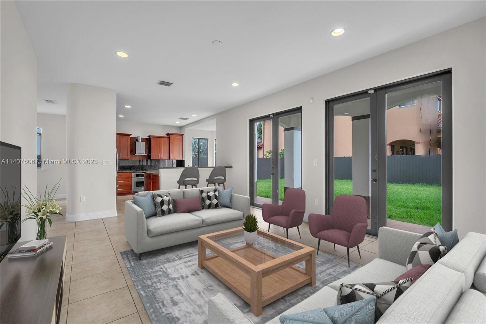 Tamiami Miami, FL 33184 - Photo 18 of 46 a living room with furniture potted plant and a large window