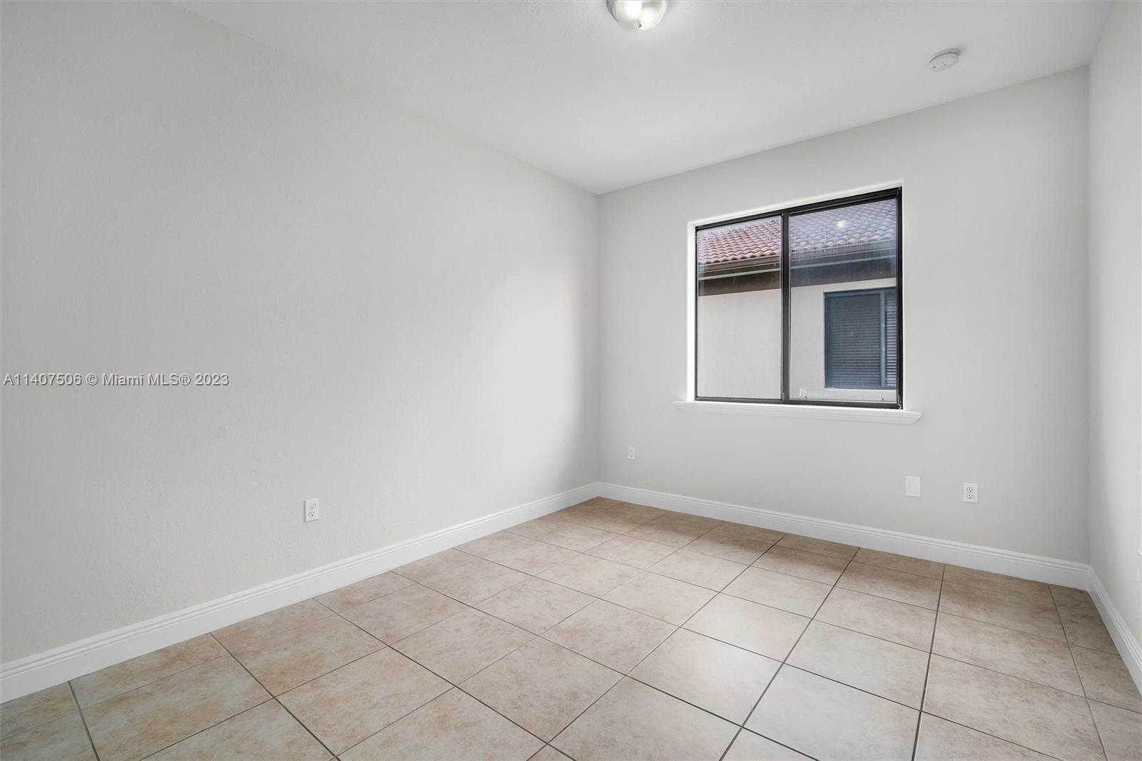 Tamiami Miami, FL 33184 - Photo 20 of 46 a view of an empty room with a window