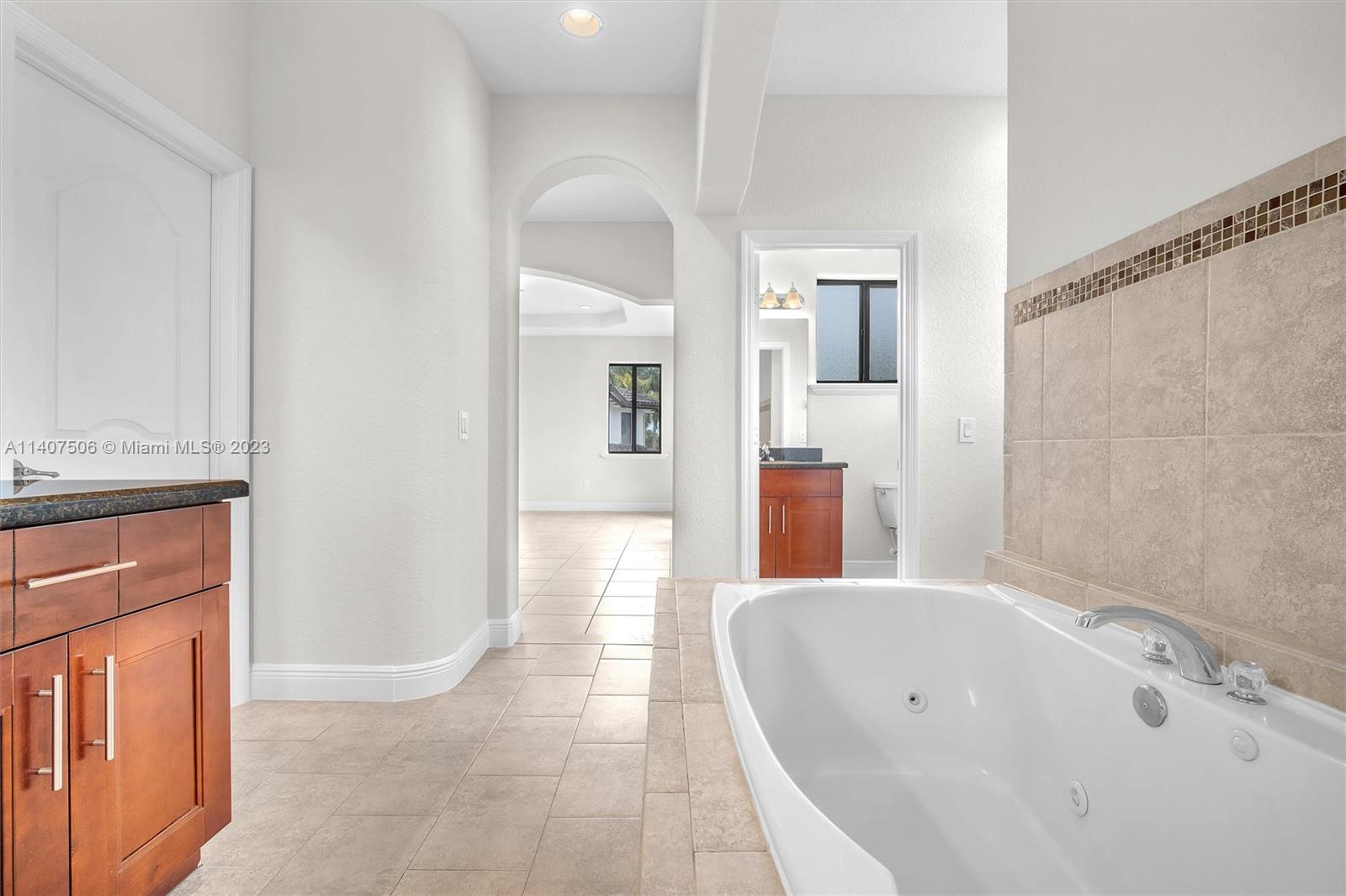 Tamiami Miami, FL 33184 - Photo 26 of 46 a bathroom with a bathtub and a sink