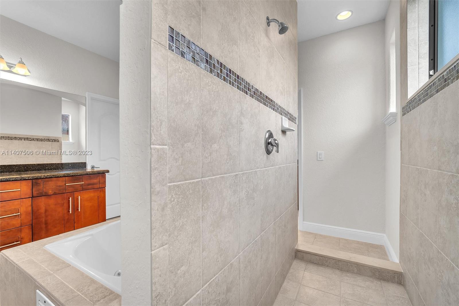 Tamiami Miami, FL 33184 - Photo 29 of 46 a bathroom with a granite countertop sink and a mirror