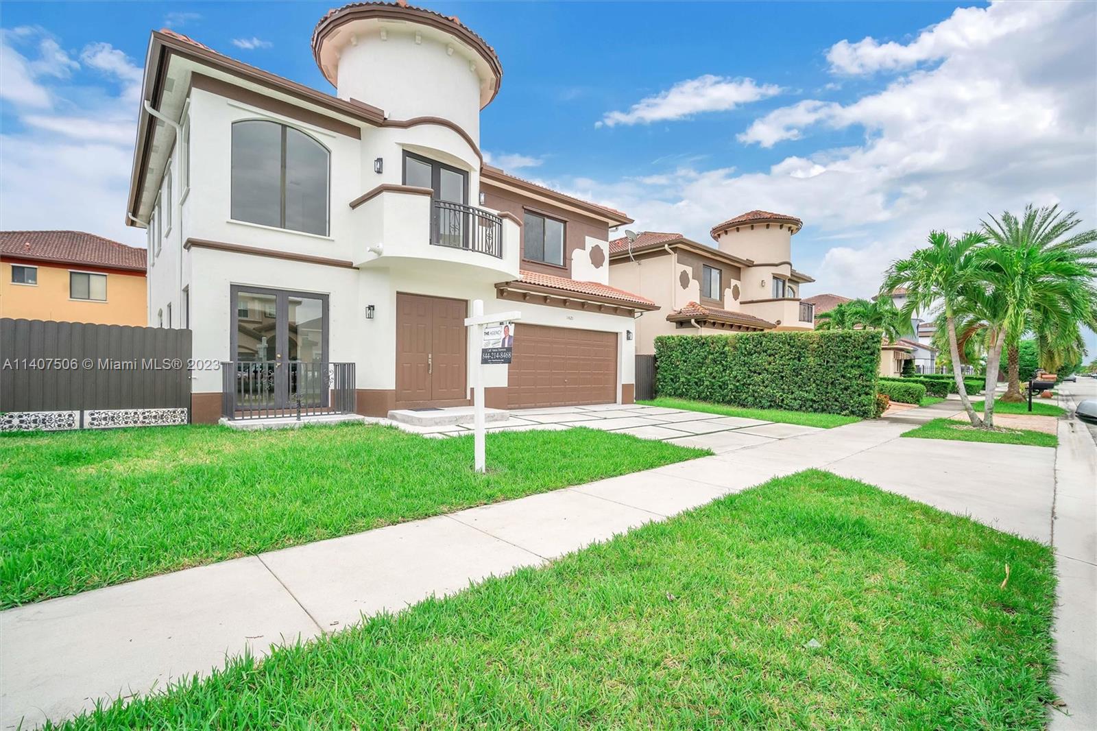 Tamiami Miami, FL 33184 - Photo 3 of 46 a front view of a house with a garden and plants