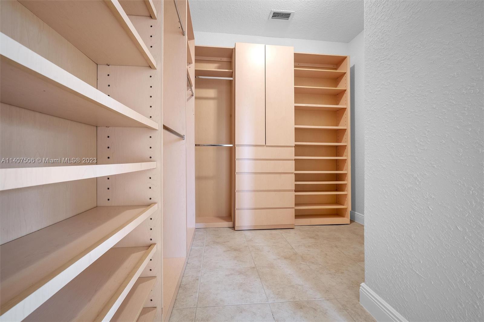 Tamiami Miami, FL 33184 - Photo 31 of 46 a view of walk in closet with empty racks