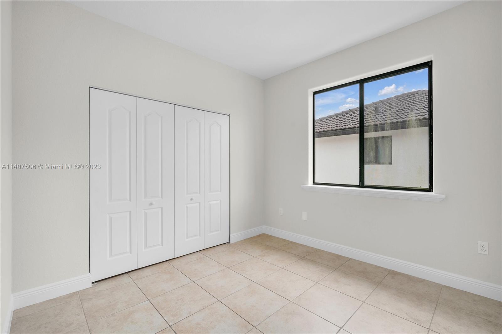 Tamiami Miami, FL 33184 - Photo 32 of 46 a view of an empty room with a window