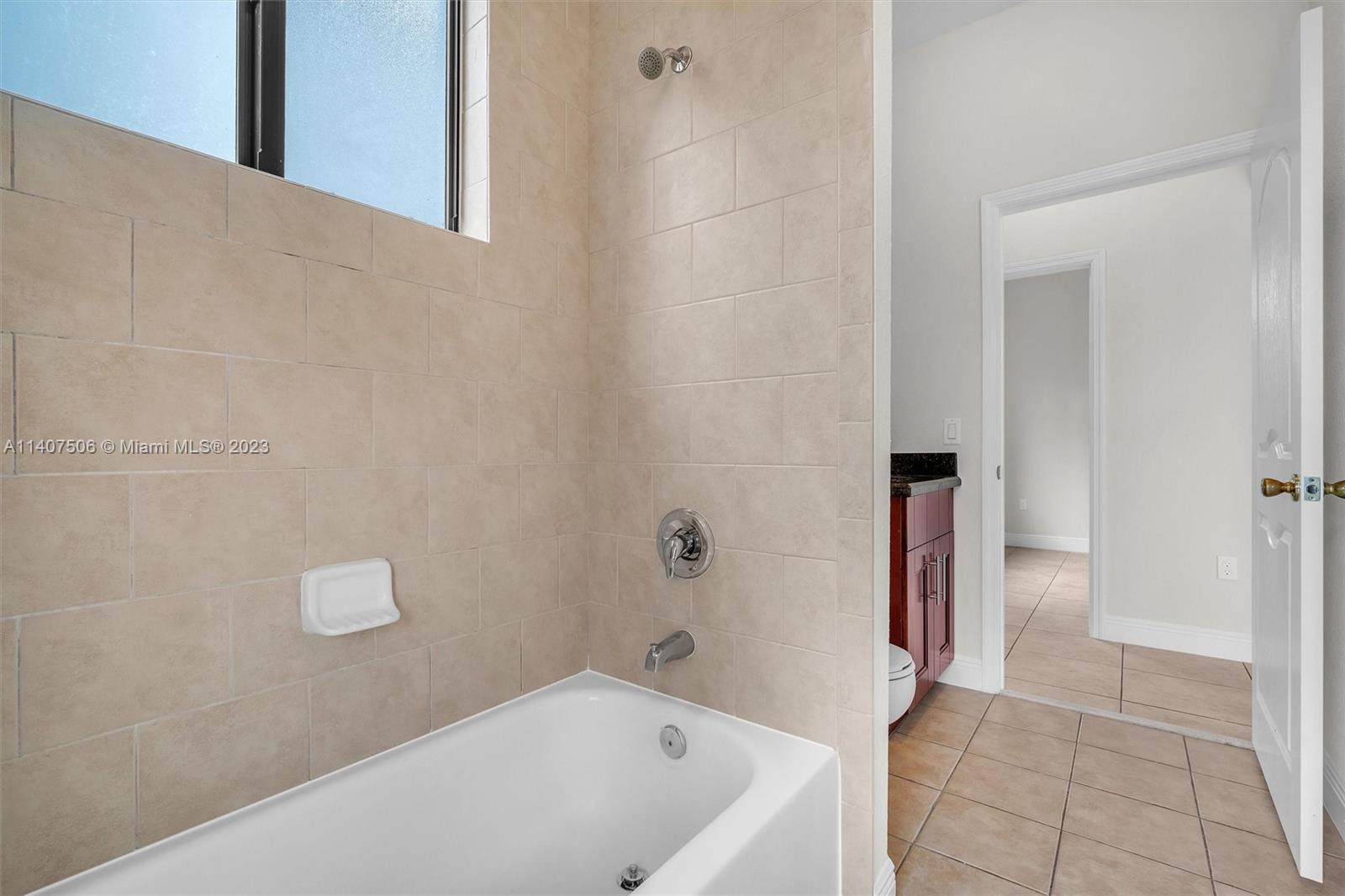 Tamiami Miami, FL 33184 - Photo 34 of 46 a bathroom with a bathtub