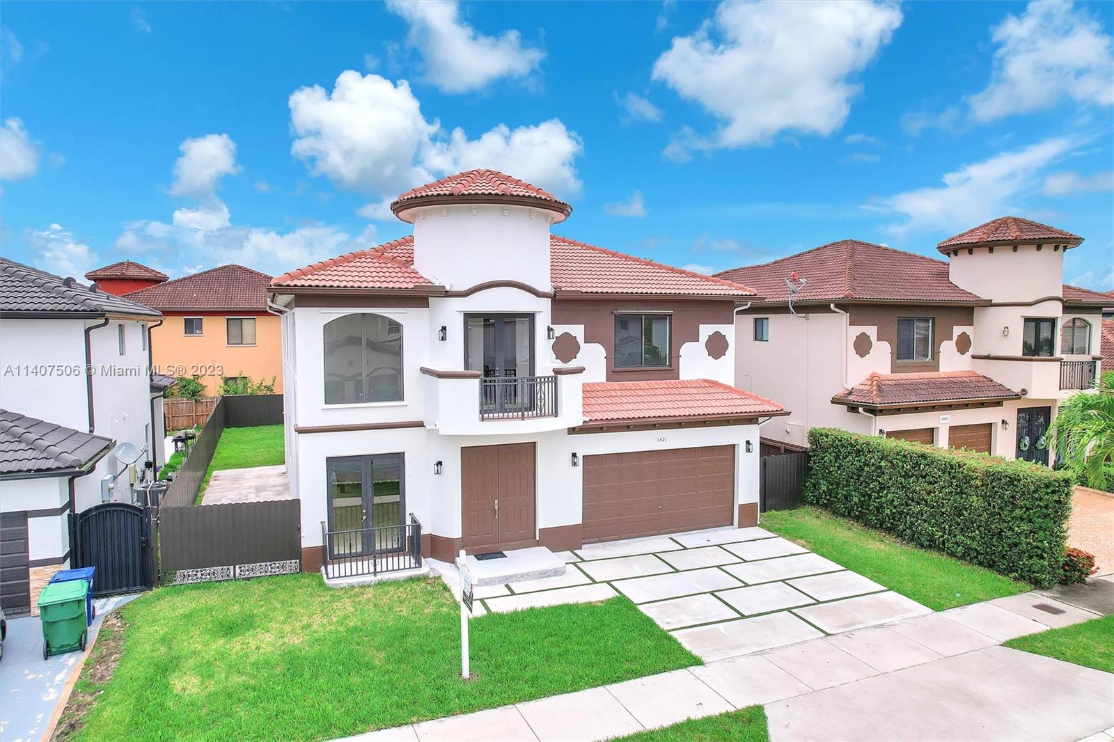 Tamiami Miami, FL 33184 - Photo 5 of 46 a front view of a house with a garden and plants