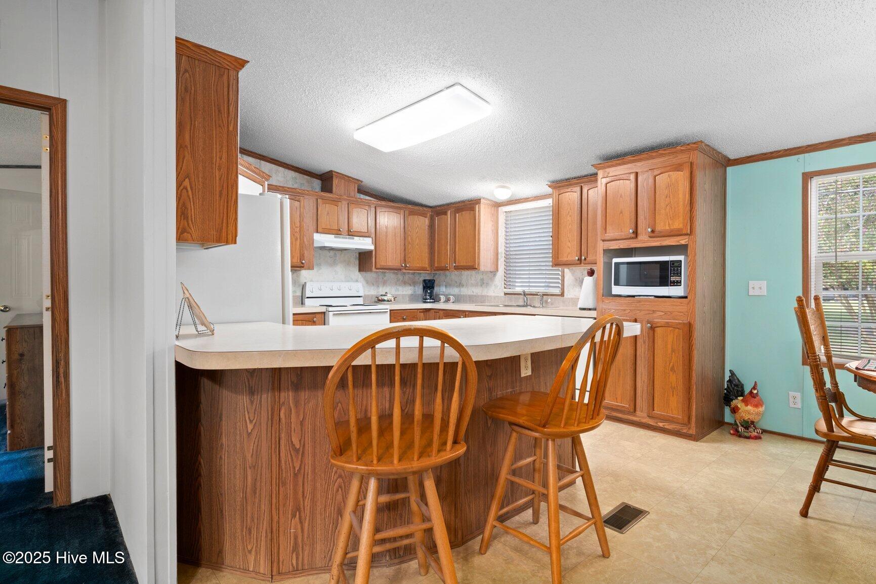 4541 Faith Baptist Church Road Pinetops, NC 27864 - Photo 10 of 29 Eat-In Kitchen also features a functional bar top!