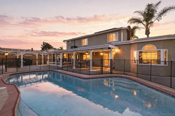 a view of a swimming pool with a patio