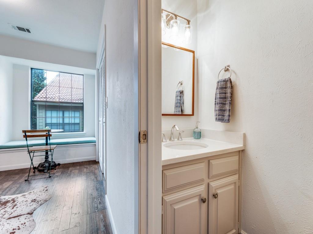 5200 Martel Avenue, Unit 6Q Dallas, TX 75206 - Photo 11 of 32 a bathroom with a sink and a mirror