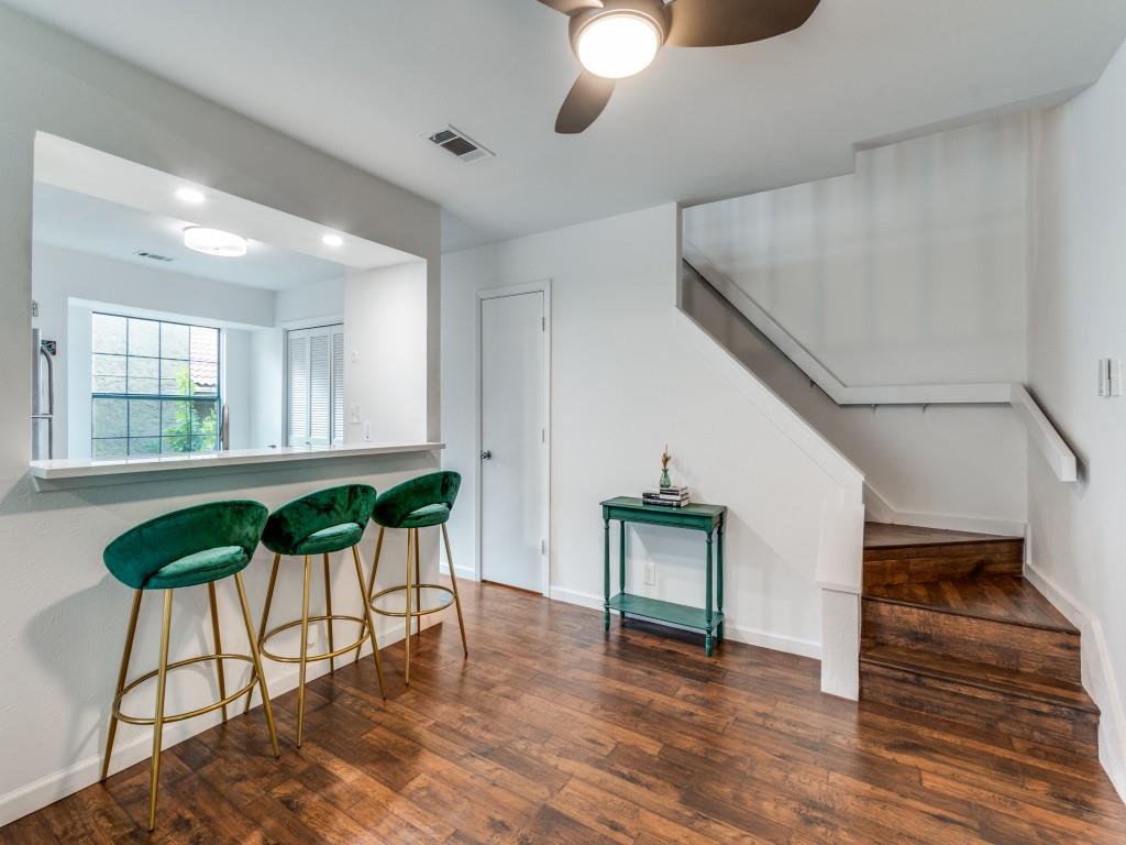 5200 Martel Avenue, Unit 6Q Dallas, TX 75206 - Photo 13 of 32 a view of a livingroom with furniture a potted plant and wooden floor