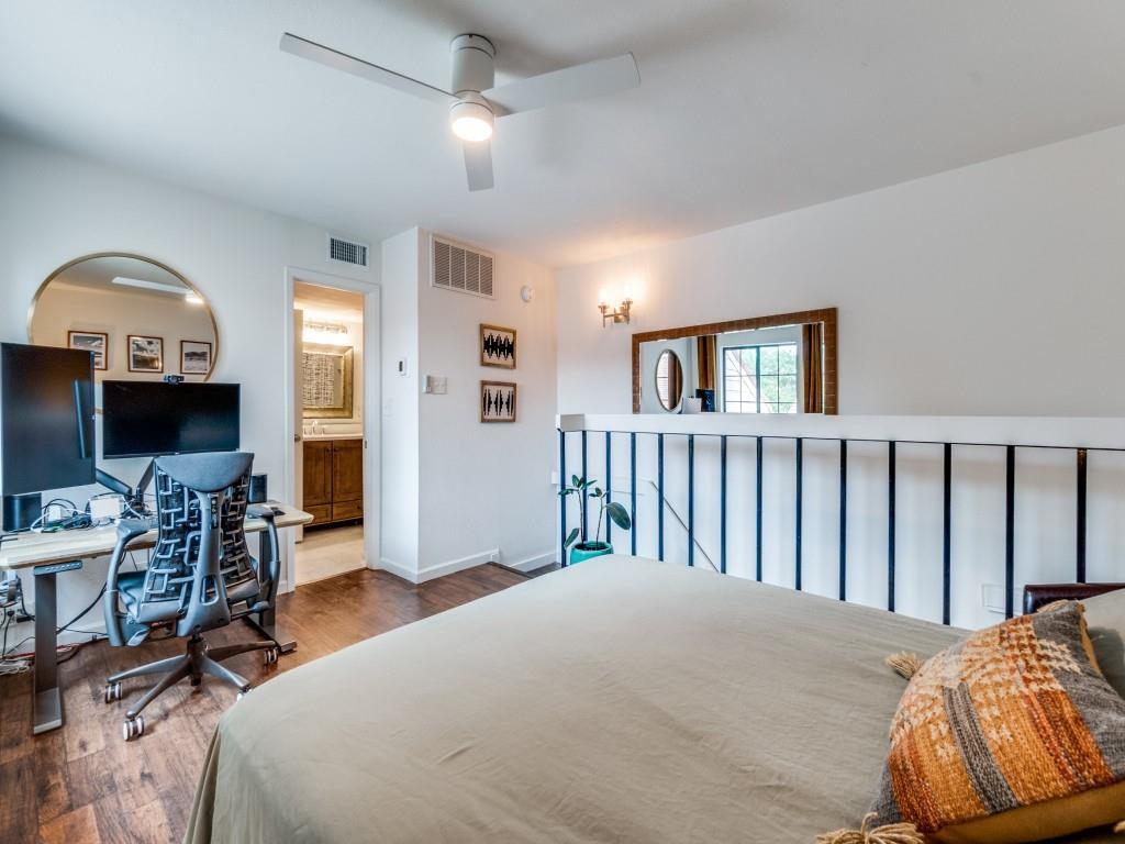 5200 Martel Avenue, Unit 6Q Dallas, TX 75206 - Photo 15 of 32 a bedroom with a bed window and a chair