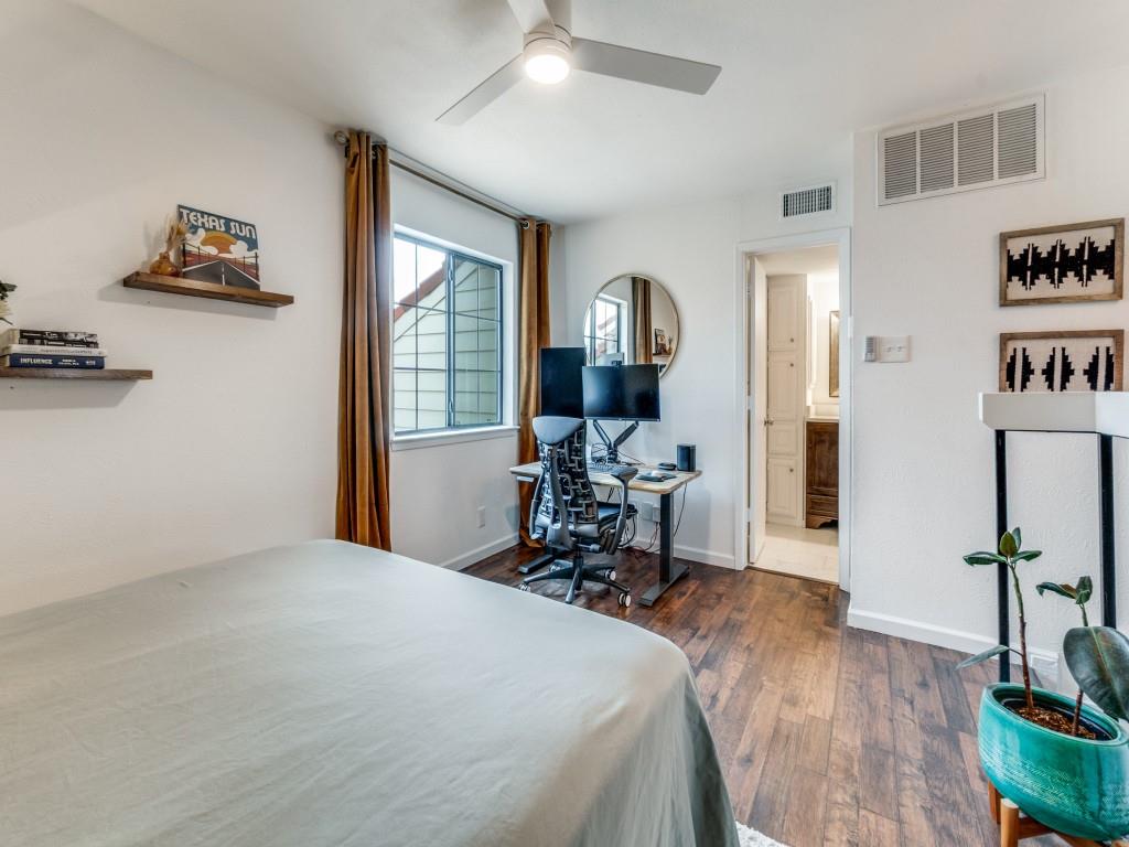 5200 Martel Avenue, Unit 6Q Dallas, TX 75206 - Photo 17 of 32 a bed room with a bed and a chair