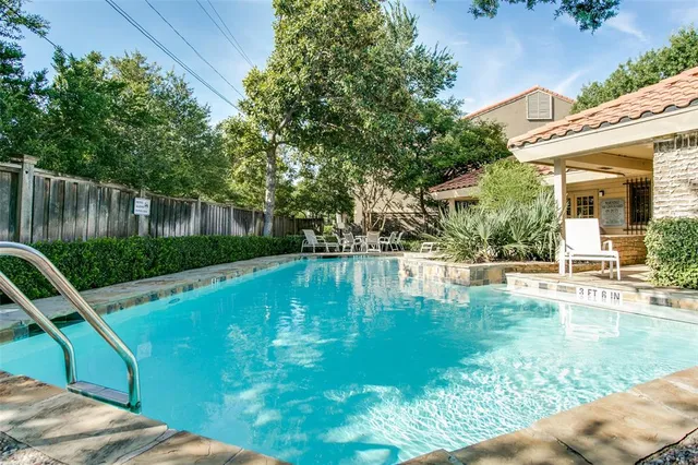 a view of a swimming pool with a patio