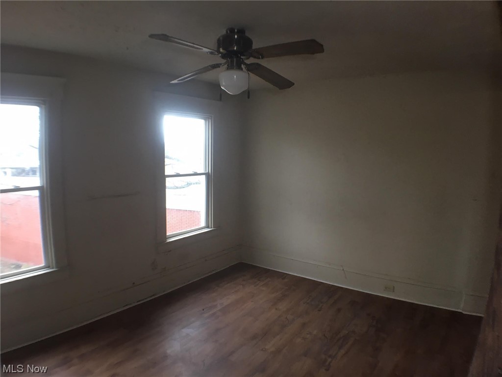 4016 Riverside Avenue Cleveland, OH 44109 - Photo 11 of 25 Spare room with dark hardwood / wood-style flooring and ceiling fan
