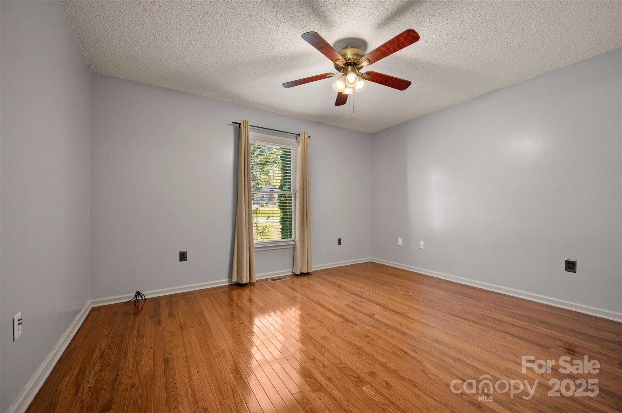 506 Pleasant Street Spindale, NC 28160 - Photo 15 of 34 wooden floor in an empty room with a window
