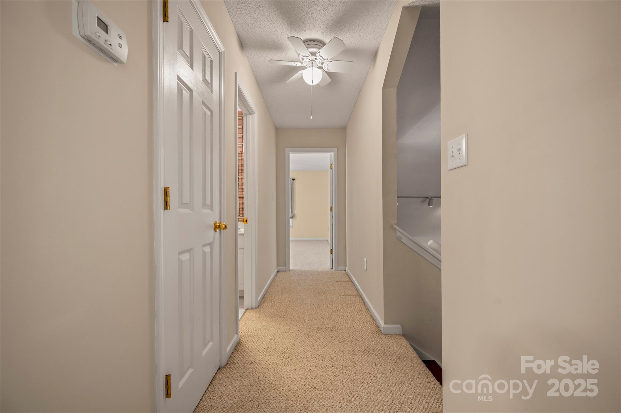 506 Pleasant Street Spindale, NC 28160 - Photo 18 of 34 a view of a hallway with a chandelier fan