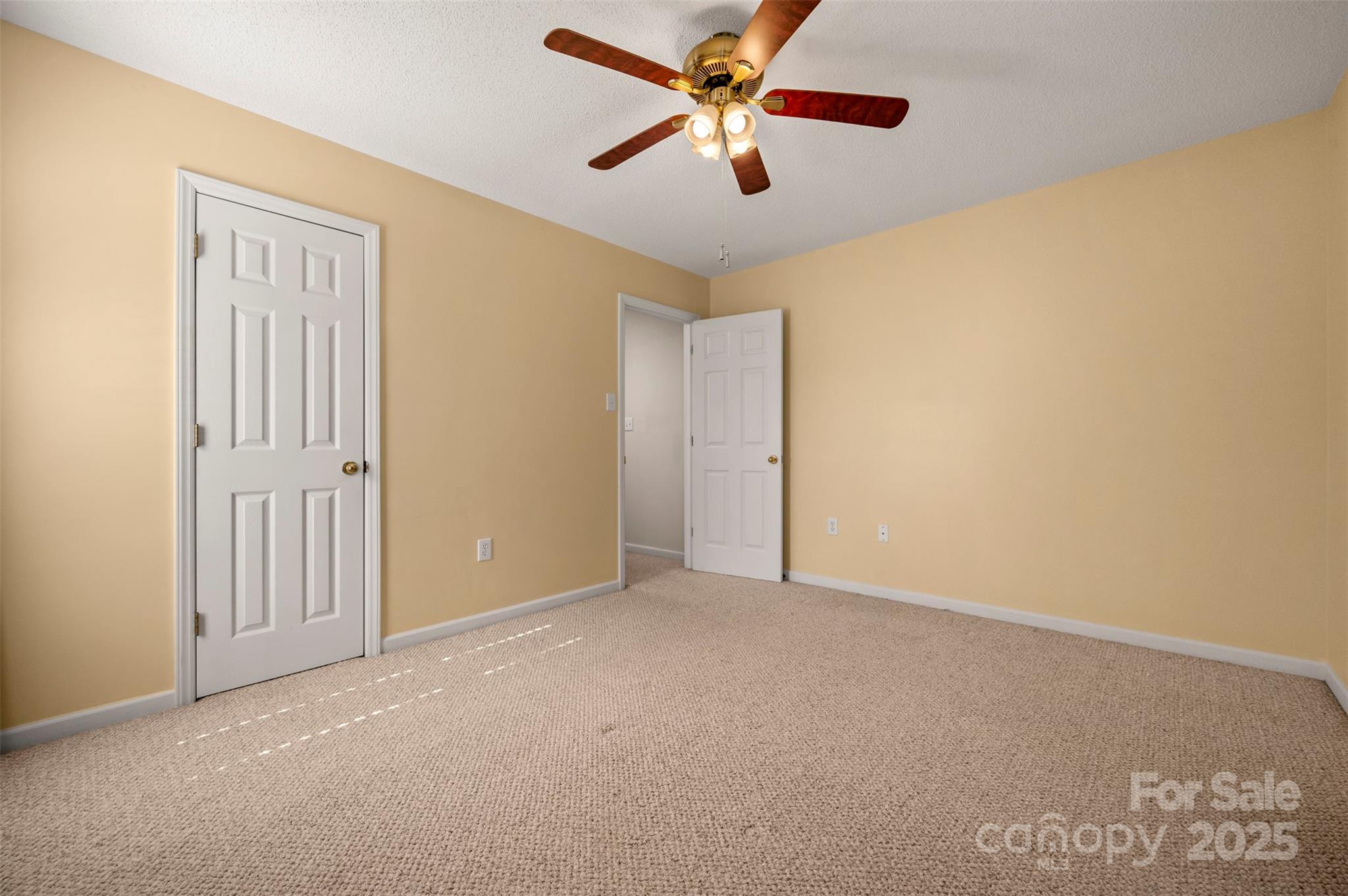 506 Pleasant Street Spindale, NC 28160 - Photo 20 of 34 an empty room with chandelier fan