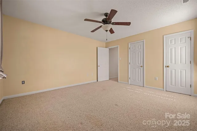 a view of a livingroom with a ceiling fan