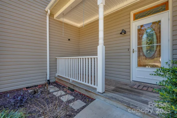 a view of a house with a door and wooden floor