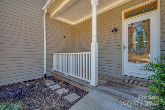 a view of a house with a door and wooden floor