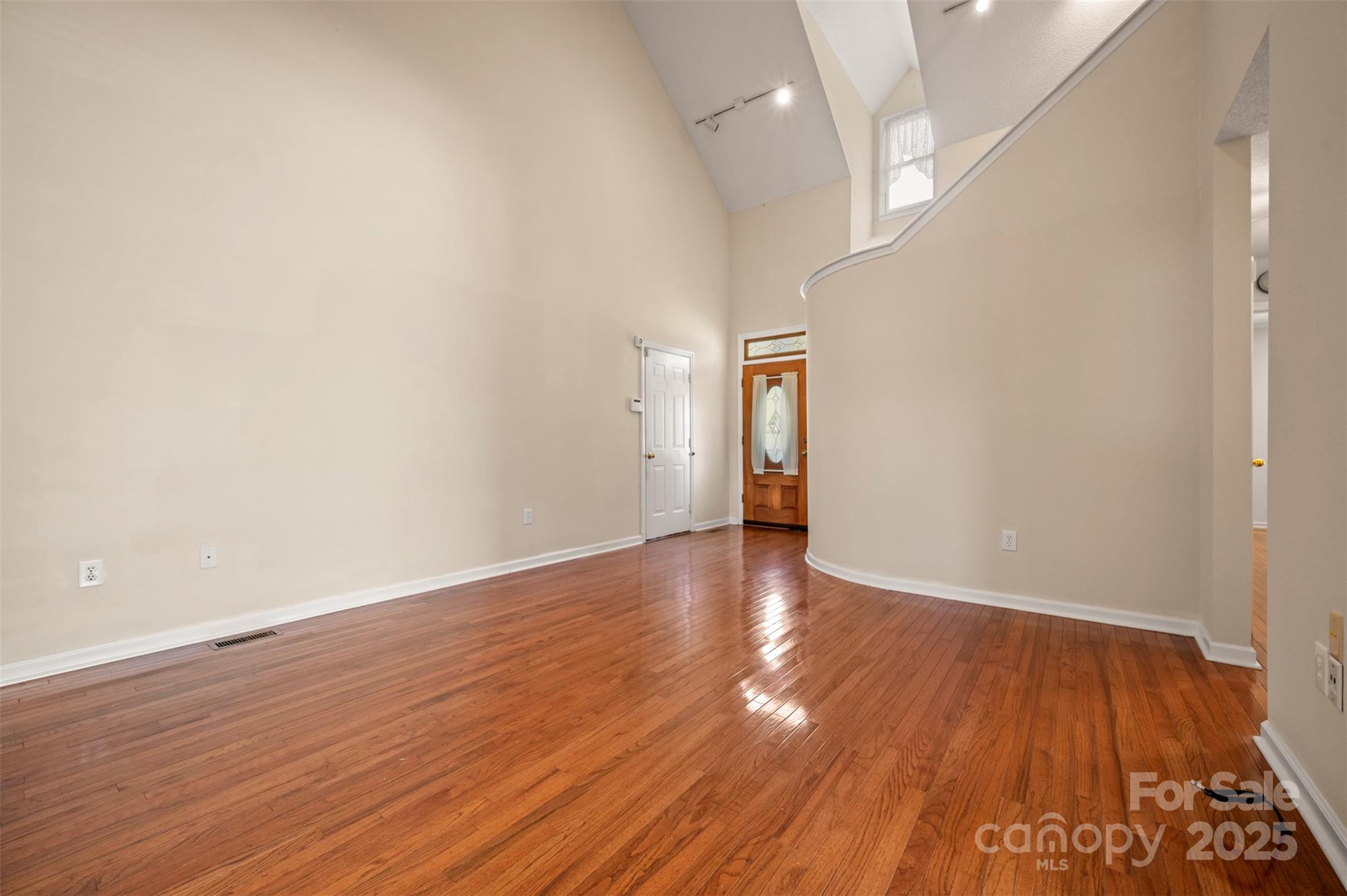 506 Pleasant Street Spindale, NC 28160 - Photo 5 of 34 a view of an empty room and wooden floor