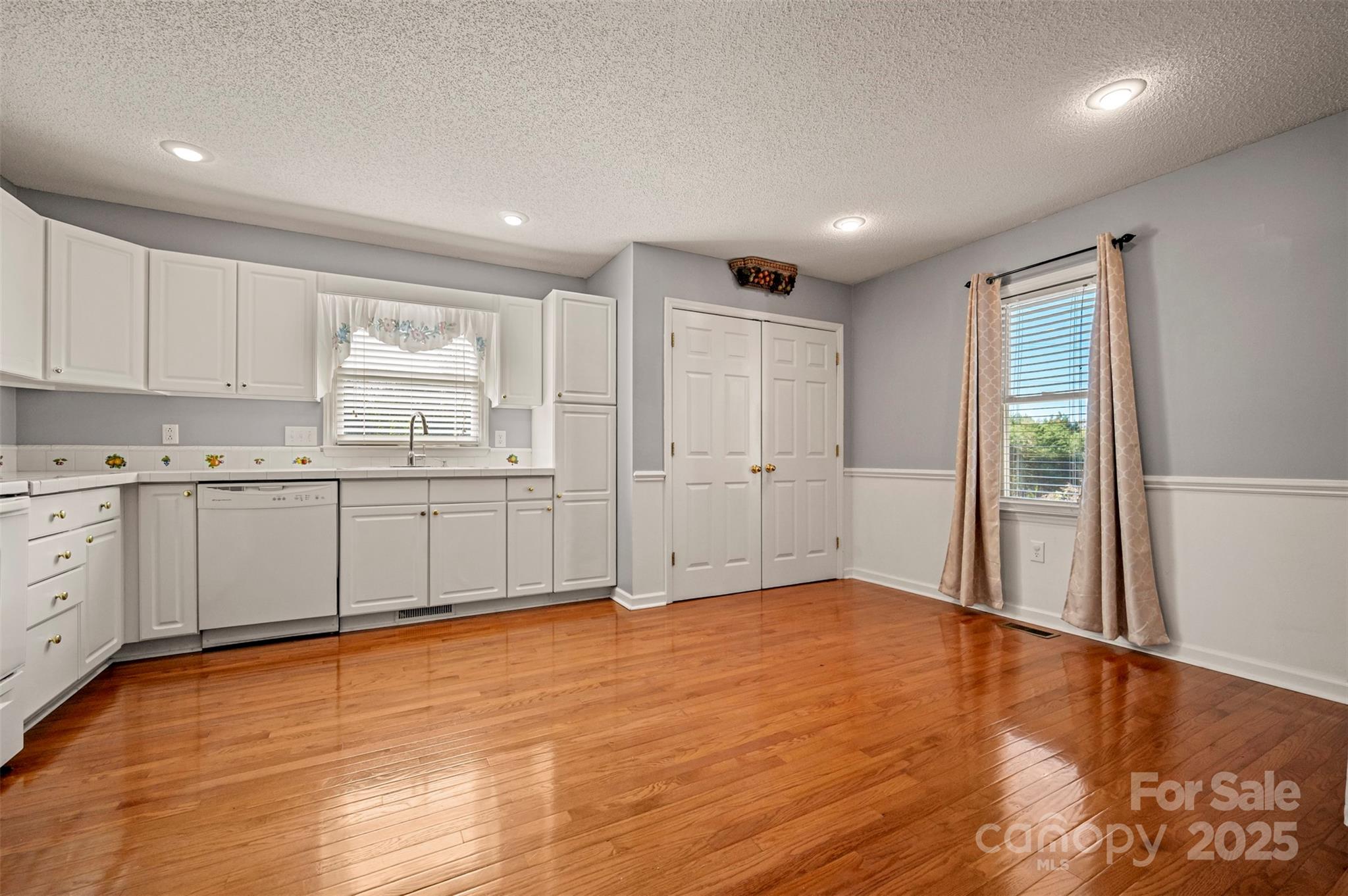 506 Pleasant Street Spindale, NC 28160 - Photo 7 of 34 a view of a kitchen with wooden cabinet and a window