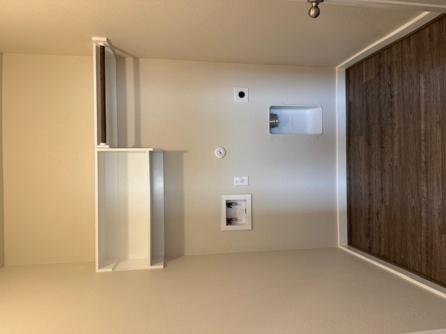 1204 Morning View Road Georgetown, TX 78628 - Photo 24 of 26 Laundry area featuring hookup for a gas dryer, dark wood finished floors, hookup for a washing machine, and electric dryer hookup