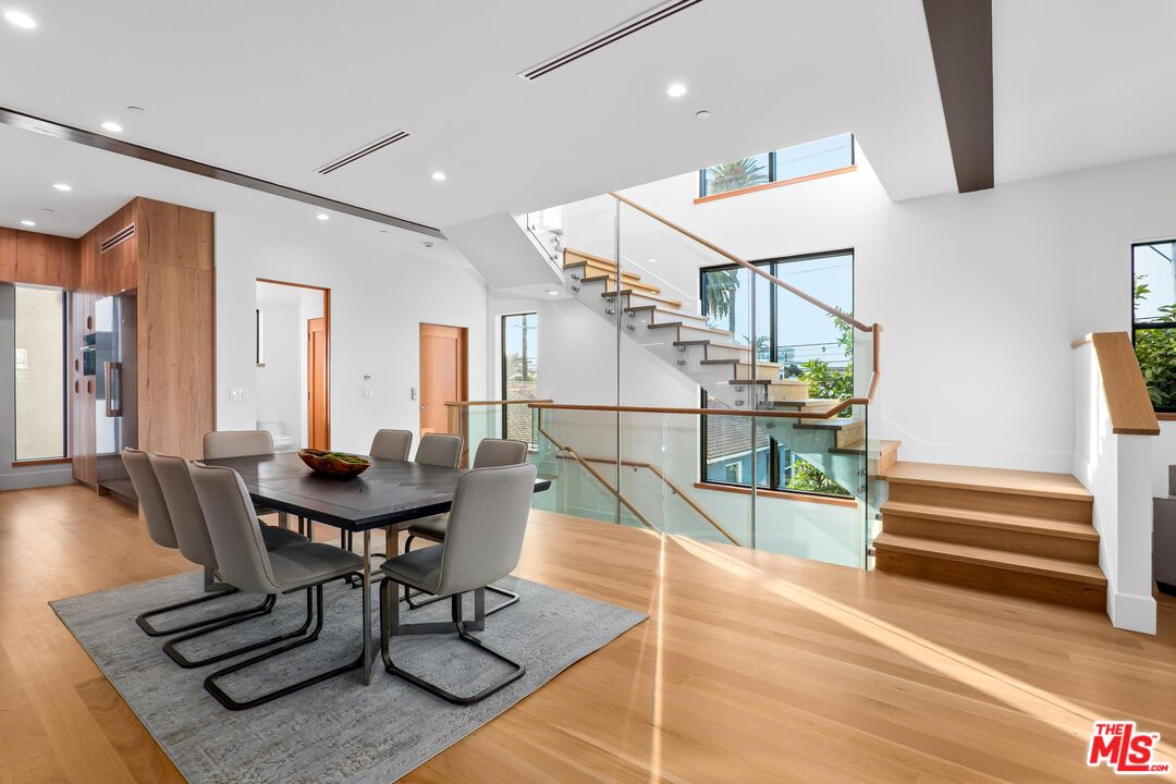 2110 Barry Avenue Los Angeles, CA 90025 - Photo 1 of 56 a dining room with furniture and wooden floor
