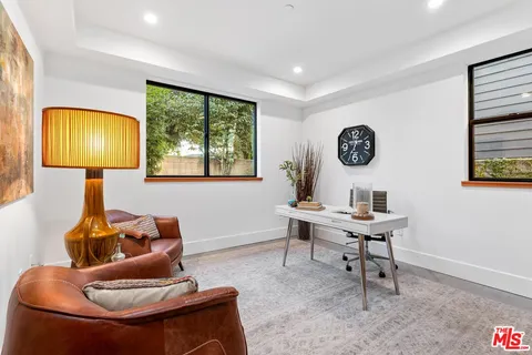 a work room with furniture and a window
