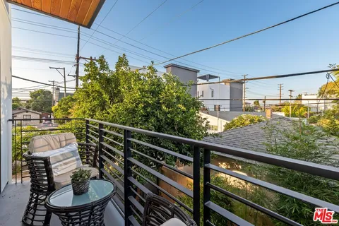 a bathroom with a toilet a sink and a window