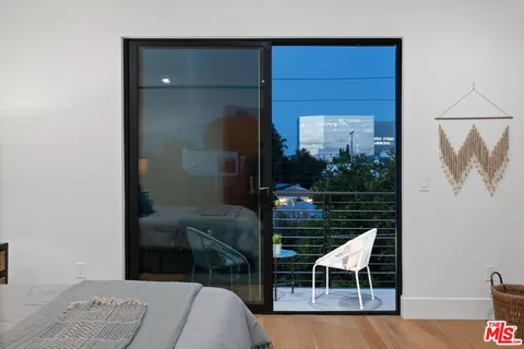 a balcony with table and chairs