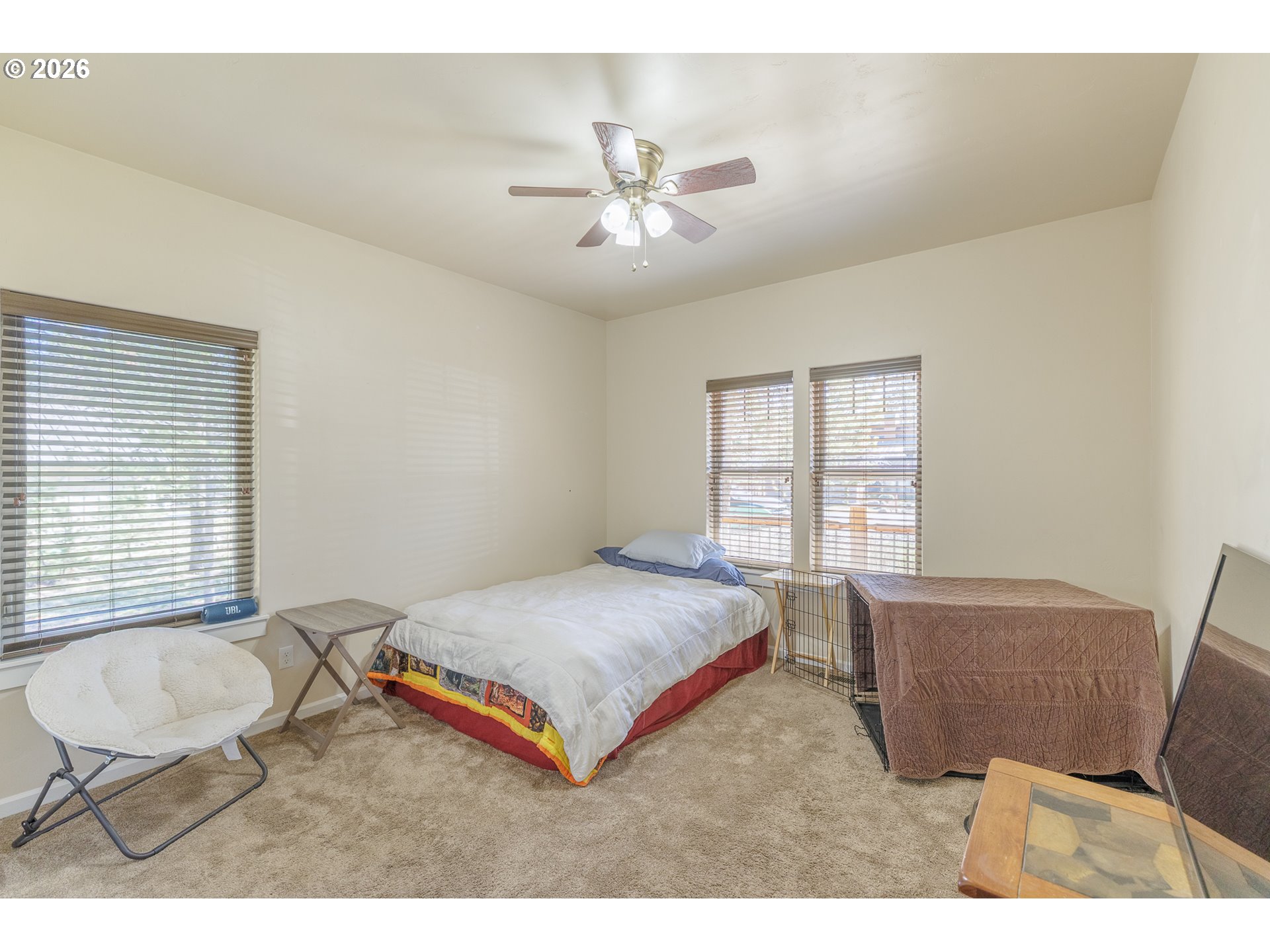 16802 Pony Express Way Bend, OR 97707 - Photo 15 of 37 a bedroom with a bed and a chair