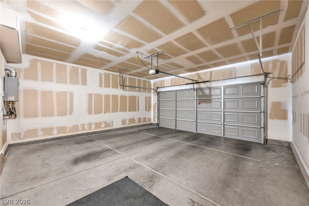 5014 Fiery Sky Ridge Street Las Vegas, NV 89148 - Photo 17 of 21 Ample garage space with a tankless water heater.