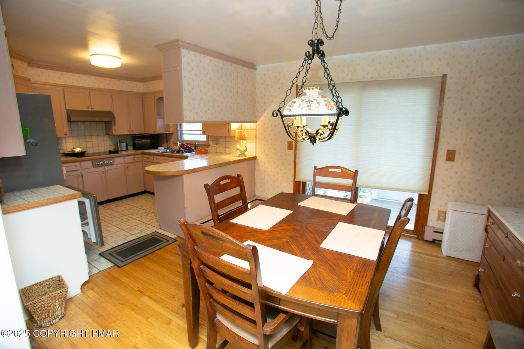 202 Norton Road Stroudsburg, PA 18360 - Photo 14 of 35 a dining room with a table chairs and a kitchen view