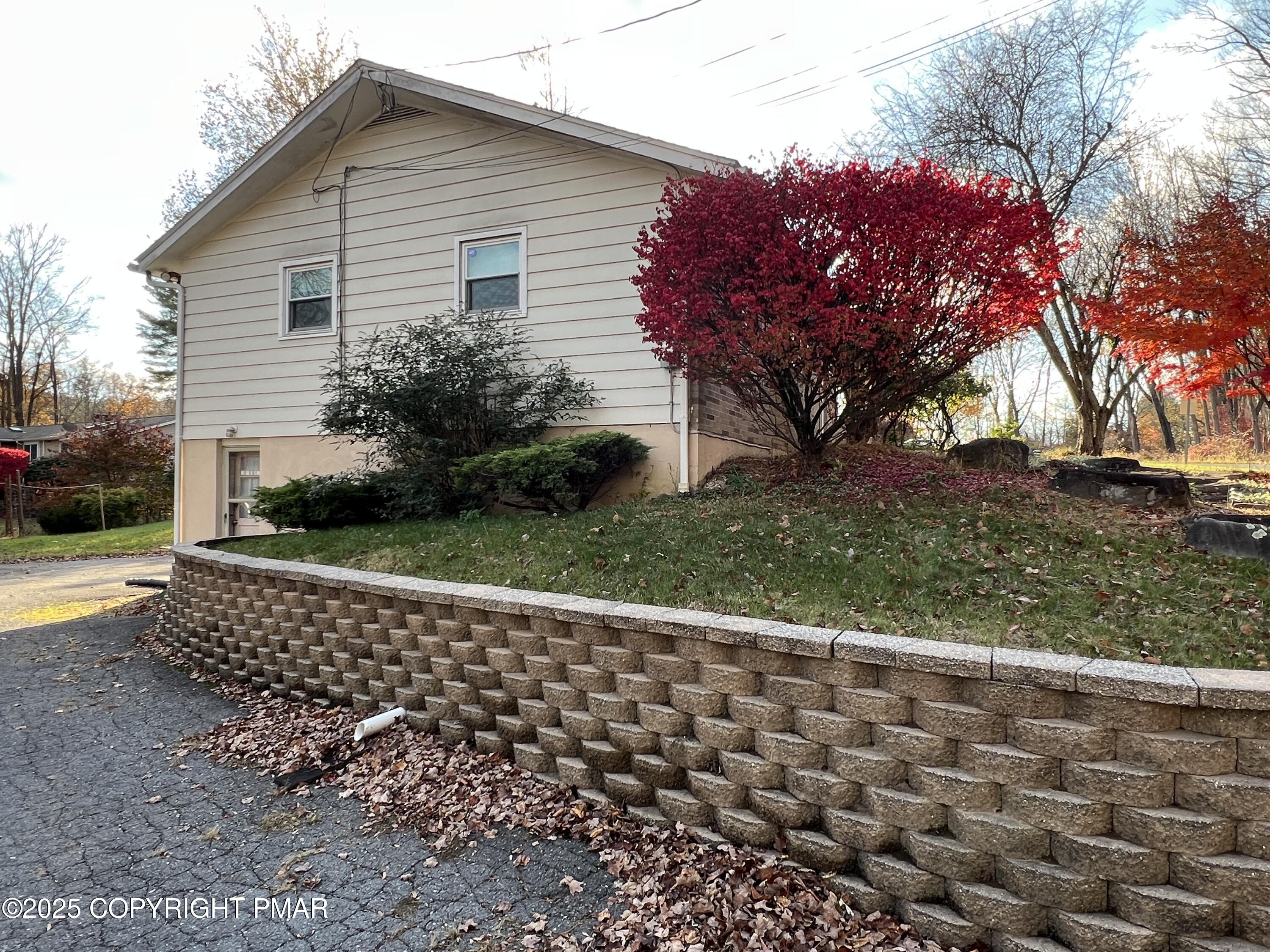 202 Norton Road Stroudsburg, PA 18360 - Photo 3 of 35 a house with a garden