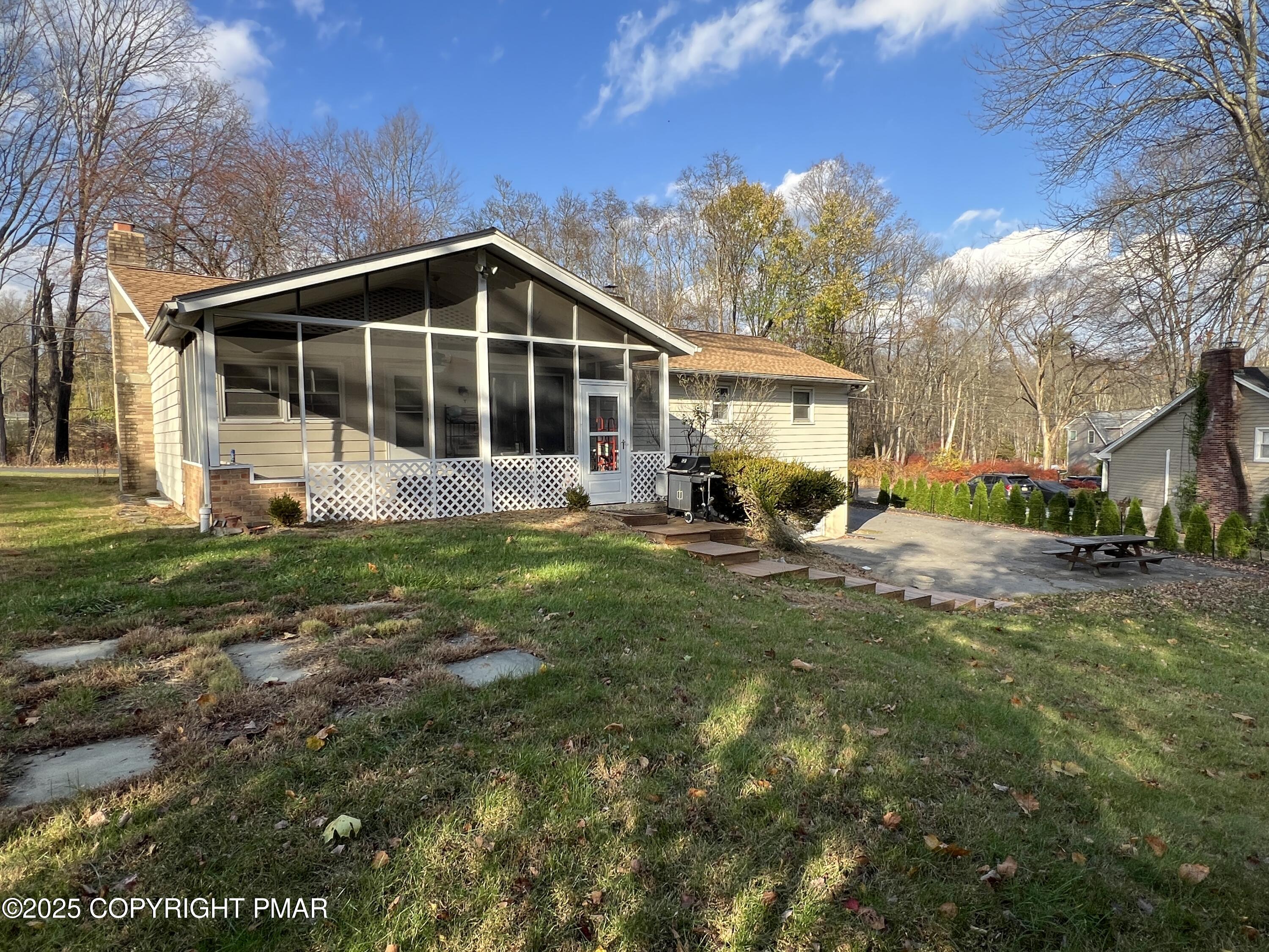 202 Norton Road Stroudsburg, PA 18360 - Photo 5 of 35 a view of a house with a yard