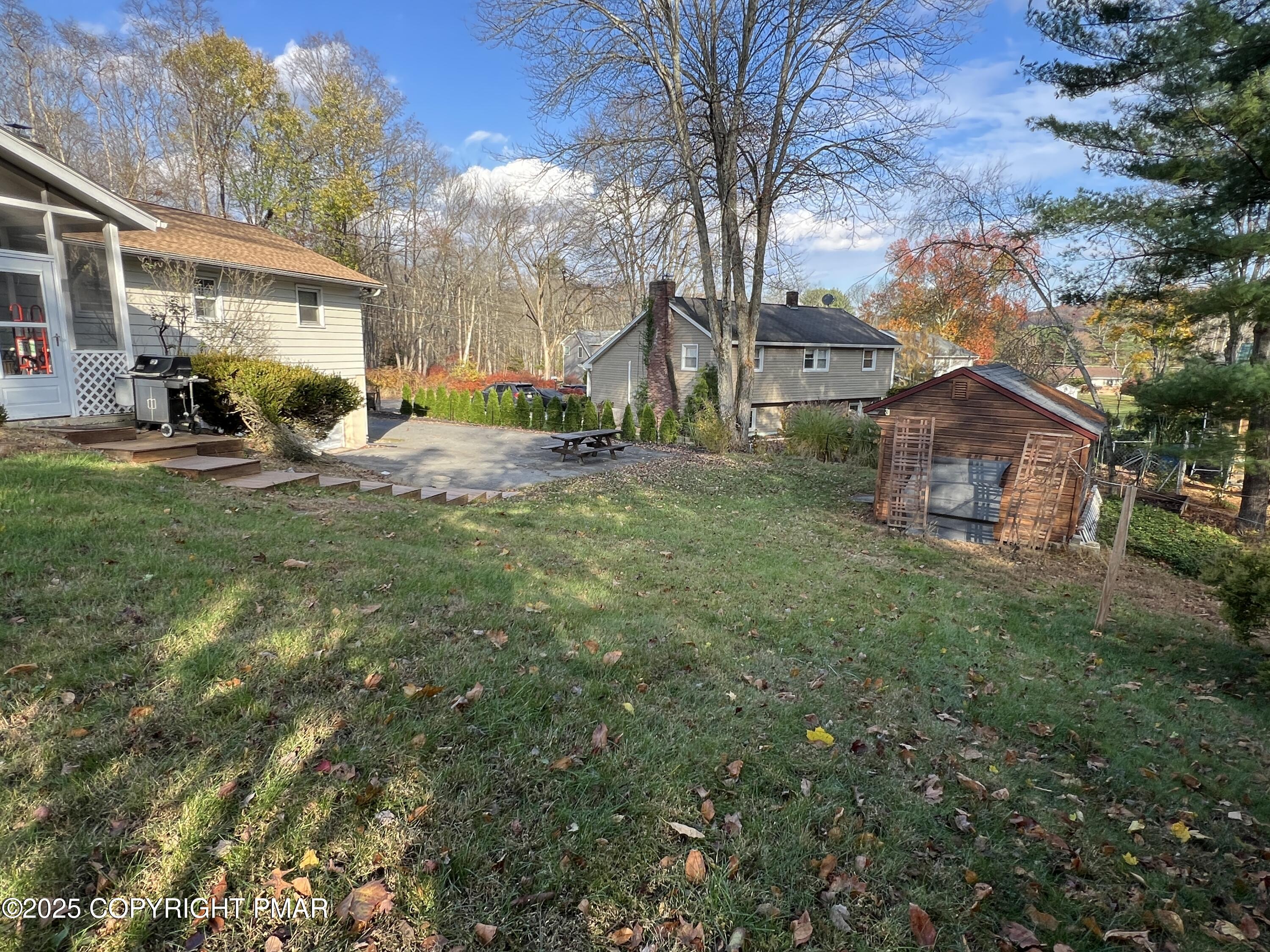202 Norton Road Stroudsburg, PA 18360 - Photo 6 of 35 a view of a house with a back yard