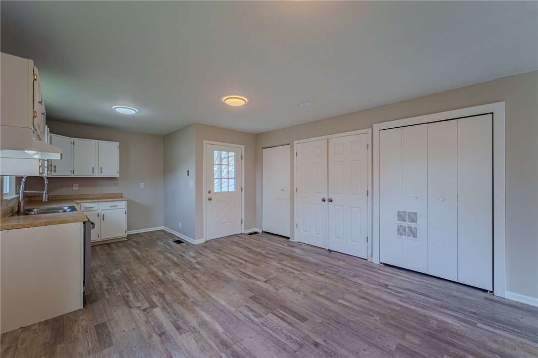 1005 Burt Street Springfield, OH 45505 - Photo 11 of 33 This bright, open space offers functional design, blending kitchen and living areas with sleek, modern flooring.