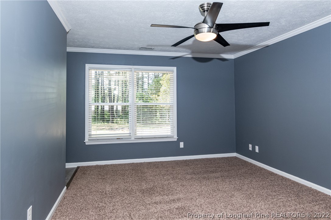 7070 Rockfish Road Raeford, NC 28376 - Photo 25 of 37 a view of an empty room with a window