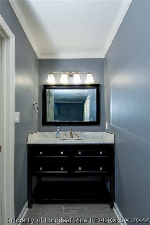 7070 Rockfish Road Raeford, NC 28376 - Photo 29 of 37 a room with a microwave a sink and cabinets
