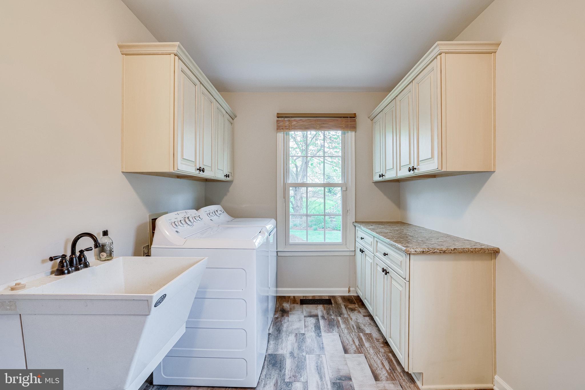138 Peyton Road Sterling, VA 20165 - Photo 24 of 64 Main Level Laundry, Sink and Storage