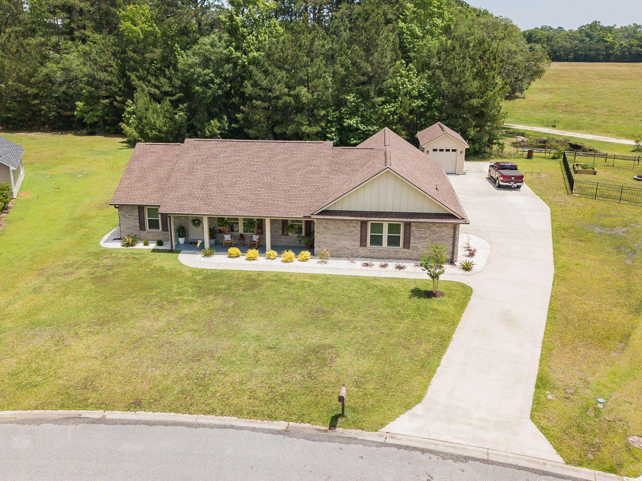 193 Field Loop Road Georgetown, SC 29440 - Photo 1 of 40 Ranch-style house with driveway, a porch, board an