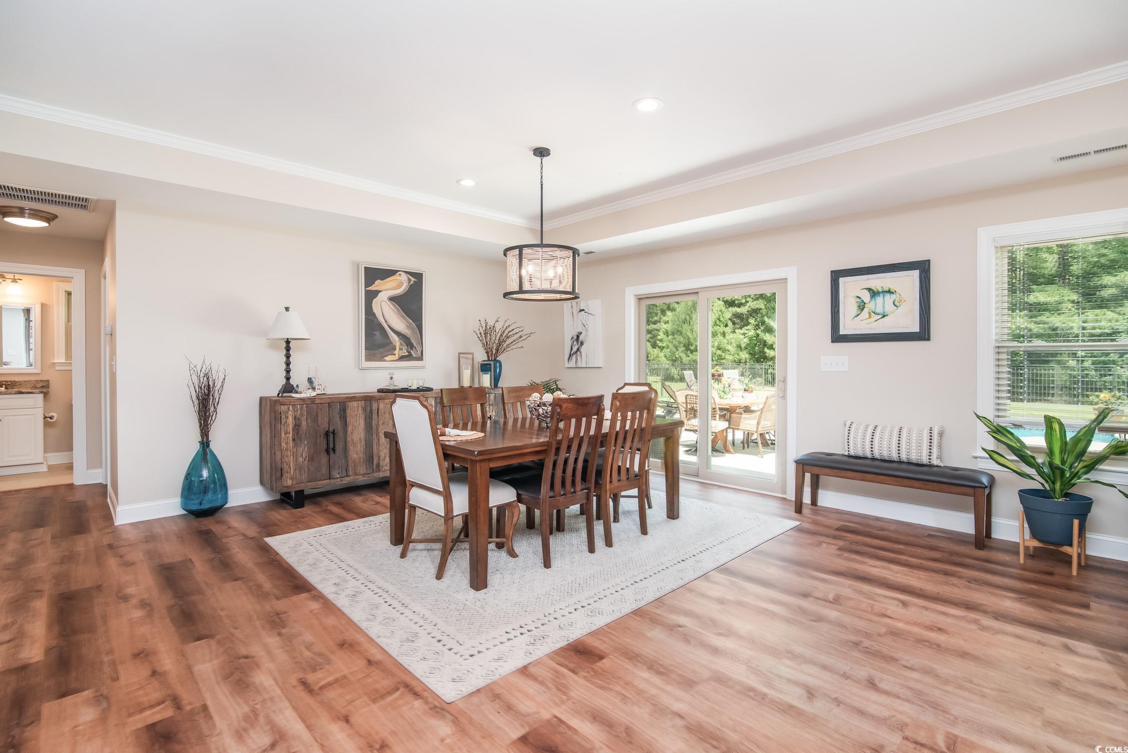 193 Field Loop Road Georgetown, SC 29440 - Photo 13 of 40 Dining space with wood finished floors, baseboards