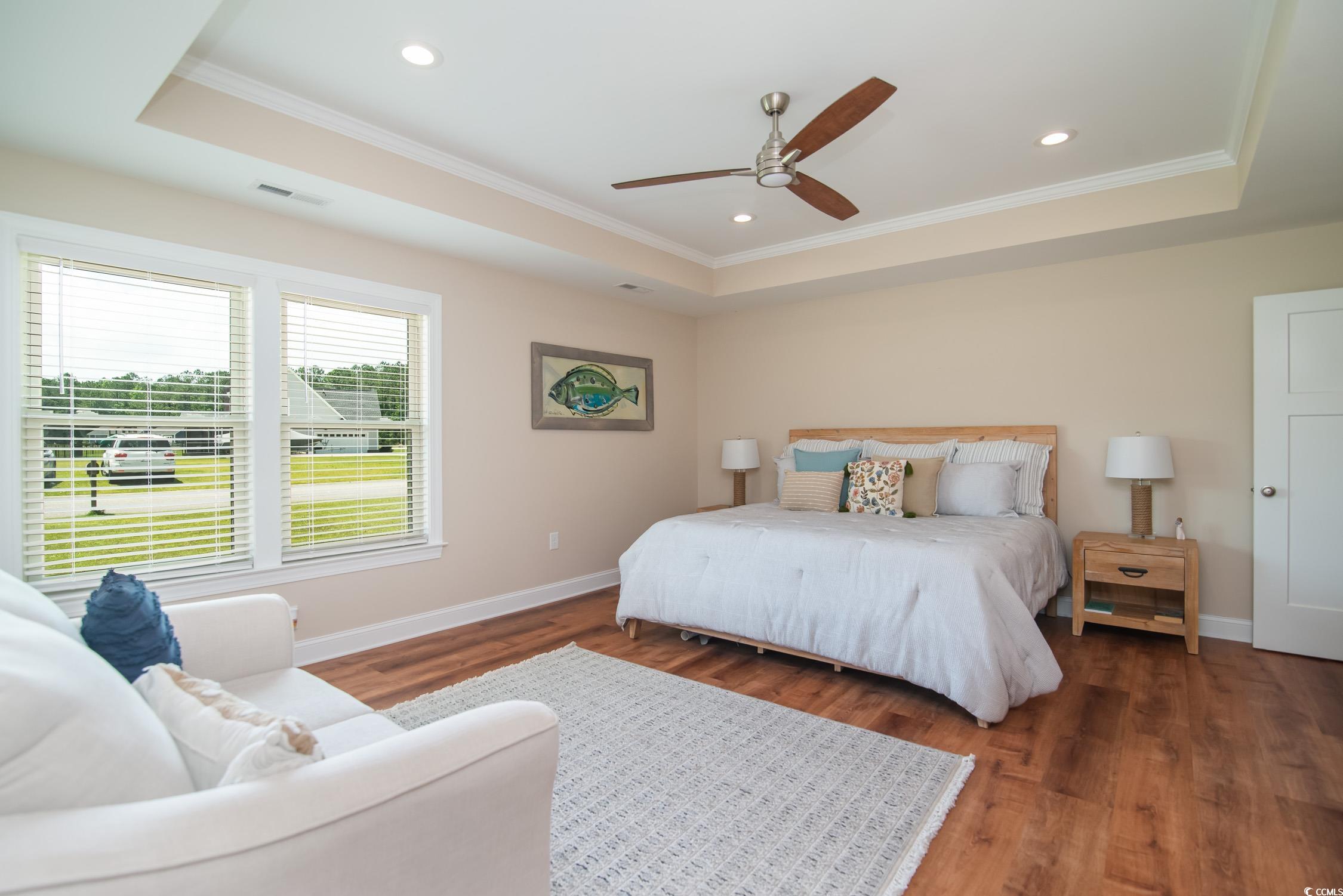 193 Field Loop Road Georgetown, SC 29440 - Photo 18 of 40 Bedroom featuring a tray ceiling, crown molding, w