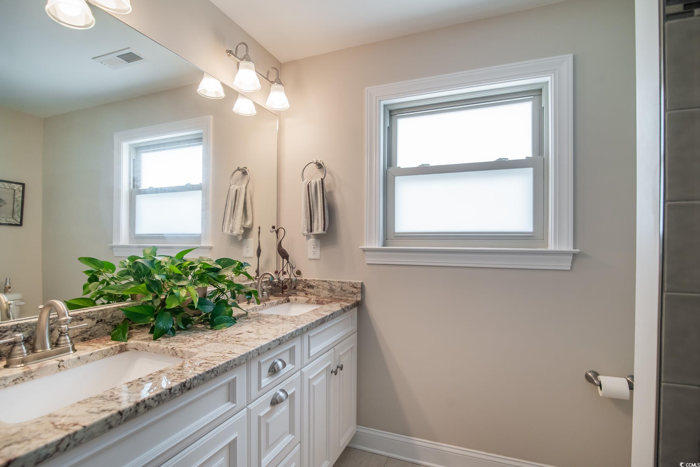 193 Field Loop Road Georgetown, SC 29440 - Photo 20 of 40 Bathroom with baseboards and double vanity